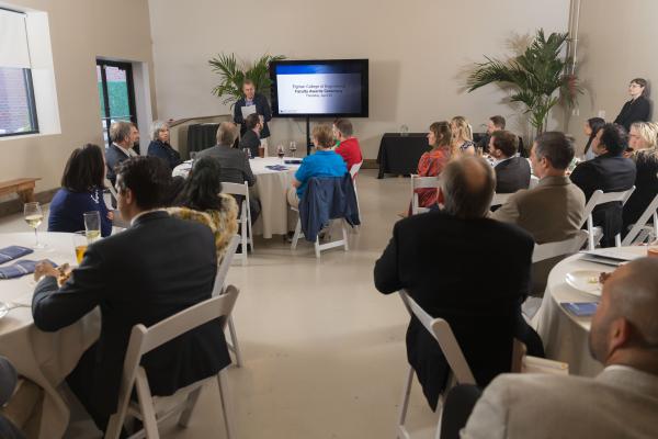 Shot of room with Dean Buchheit at podium at 2026 Faculty Awards Ceremony 